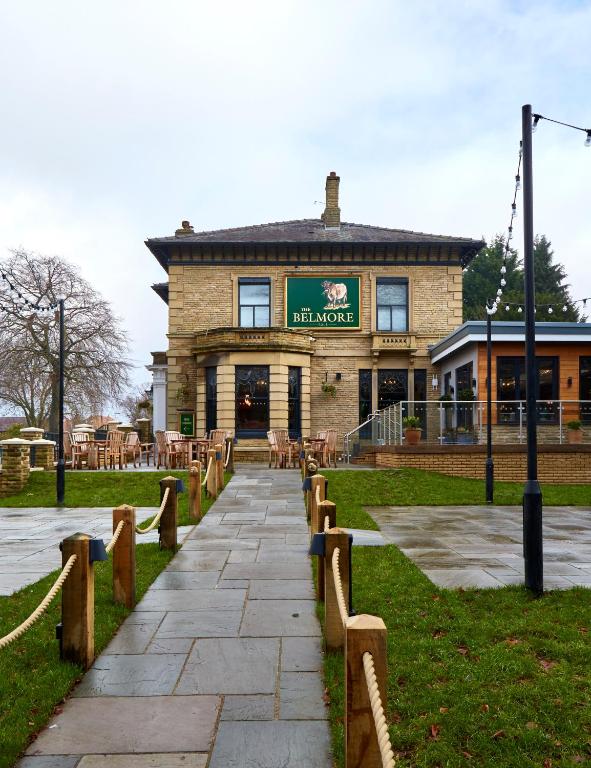 a building with a walkway in front of it at The Belmore in Sale