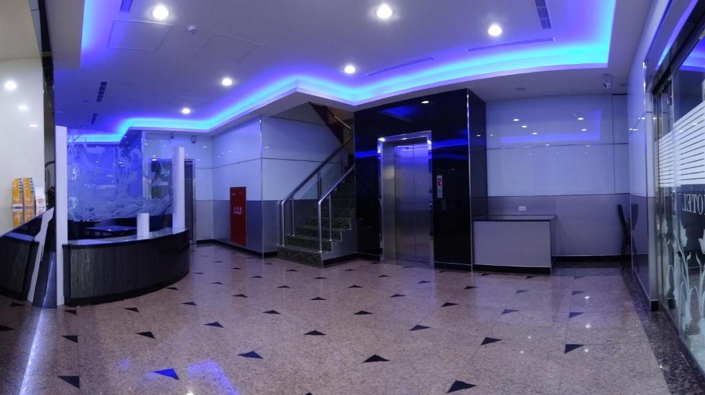 an empty room with an aquarium in a building at Klai Hotel in Kaohsiung