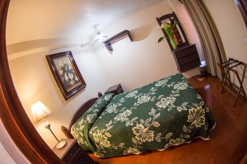 Postel nebo postele na pokoji v ubytování Hotel posada casa regia
