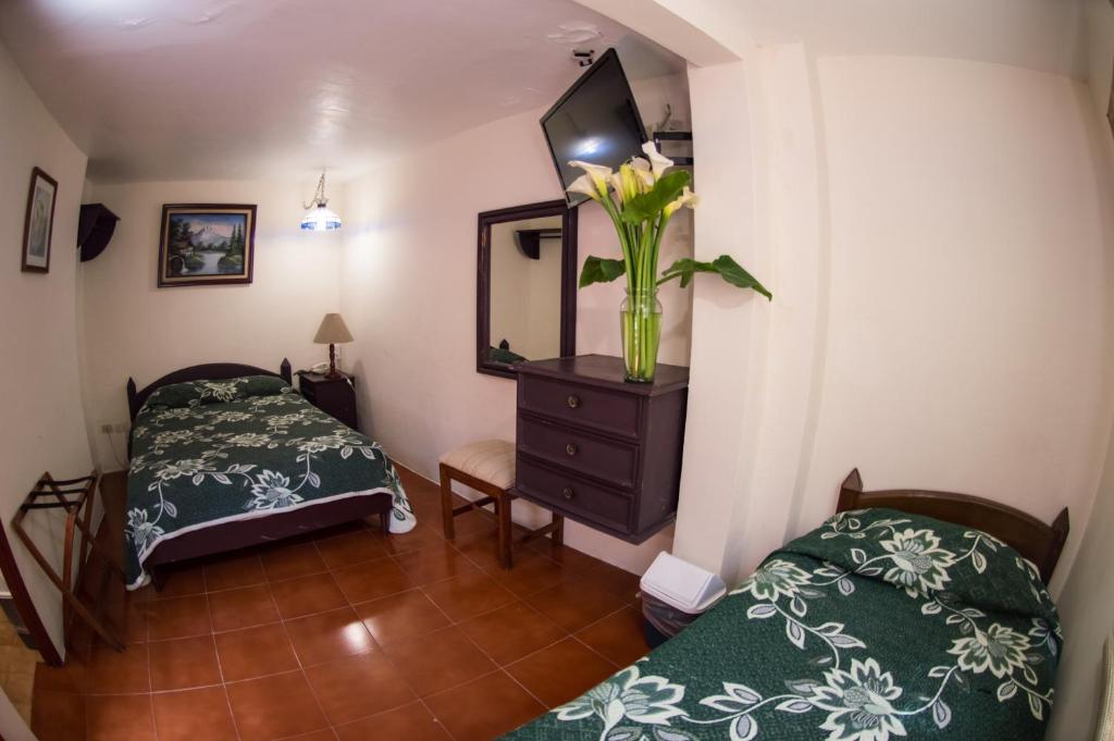 Postel nebo postele na pokoji v ubytování Hotel posada casa regia