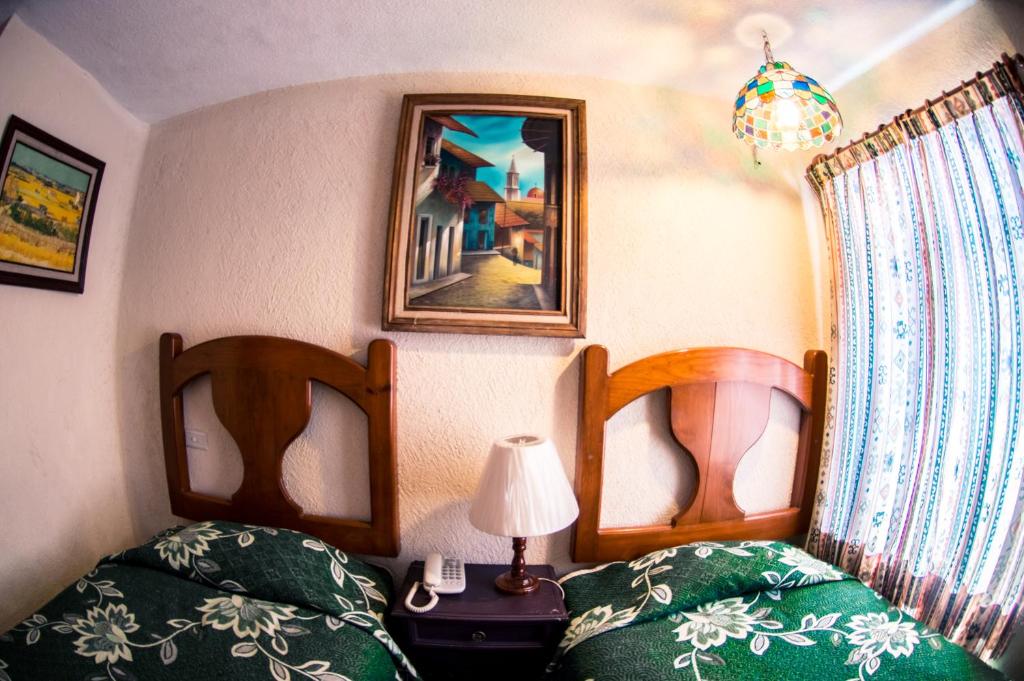 Postel nebo postele na pokoji v ubytování Hotel posada casa regia