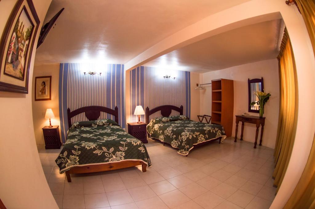 Postel nebo postele na pokoji v ubytování Hotel posada casa regia