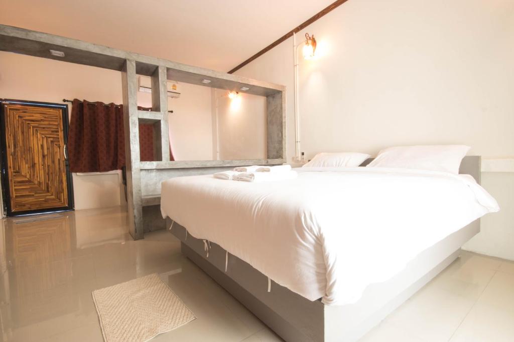 Postel nebo postele na pokoji v ubytování AVA Boutique Guesthouse