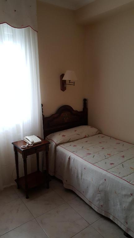 Posteľ alebo postele v izbe v ubytovaní Hotel Cortijo