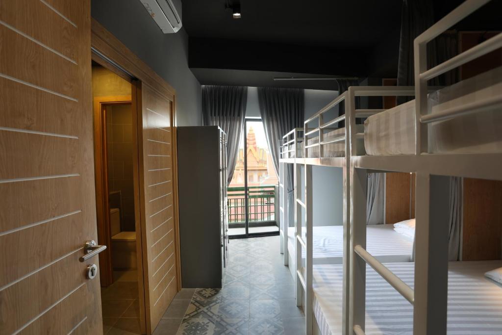 Postel nebo postele na pokoji v ubytování RS II Guesthouse