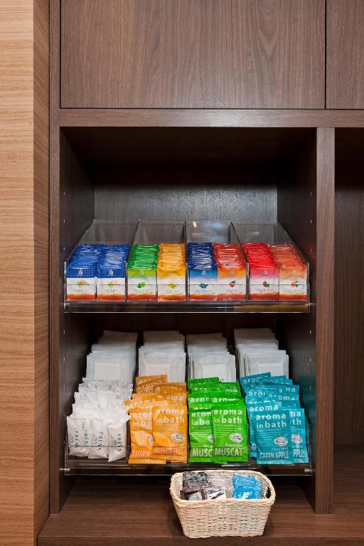 a shelf filled with lots of different types of food at Sotetsu Fresa Inn Tokyo-Toyocho in Tokyo