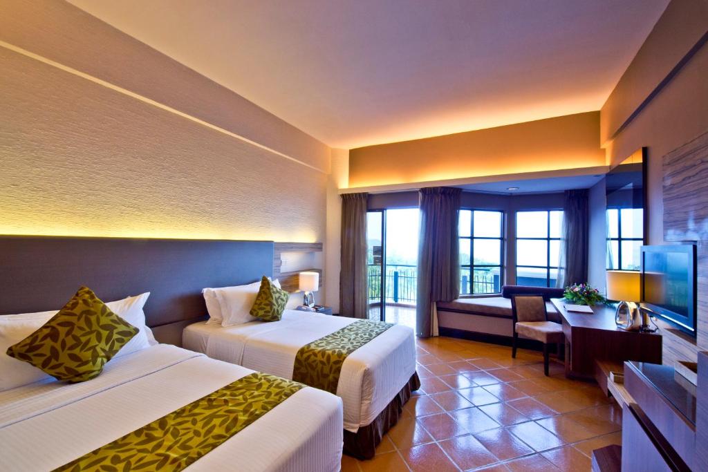 Letto o letti in una camera di Thistle Port Dickson Resort