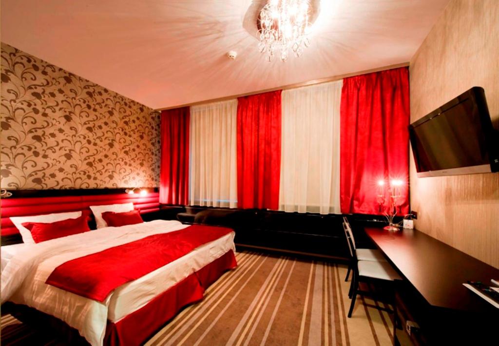 Postel nebo postele na pokoji v ubytování Hotel Symfonia Osjaków