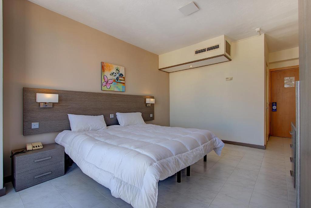 Postel nebo postele na pokoji v ubytování Primera Hotel