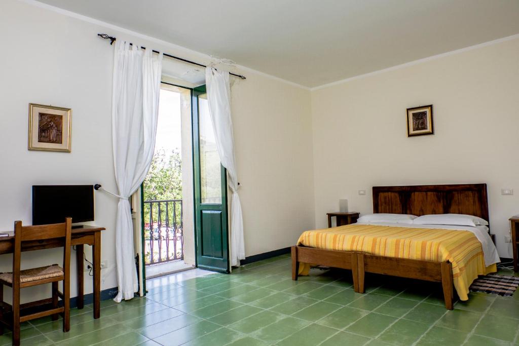Postel nebo postele na pokoji v ubytování Barone GR Macrì Agriturismo Modi