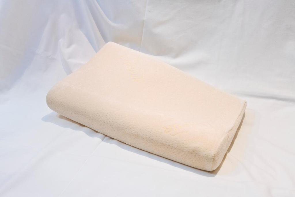 a white pillow sitting on top of a white table at Sotetsu Fresa Inn Tokyo-Toyocho in Tokyo