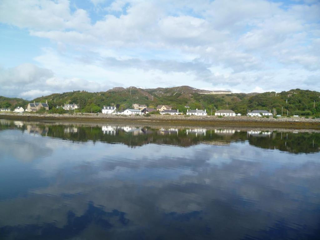 a large body of water with houses in the background at Tigh na Sith in Lochinver