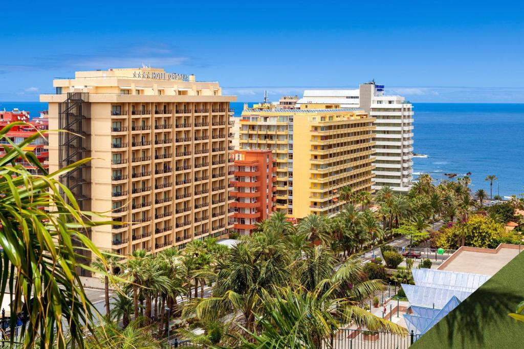 a view of a city with palm trees and the ocean at Be Live Experience Orotava in Puerto de la Cruz