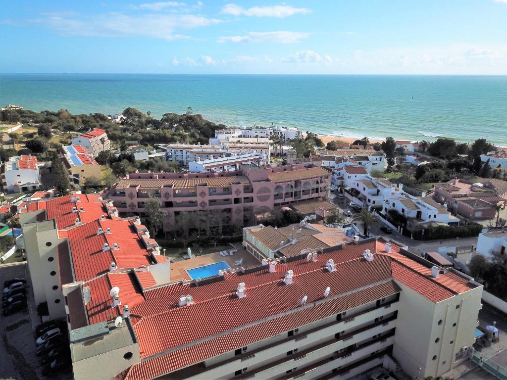 an aerial view of a city and the ocean at Apartamento Velamar - 250 m from the Beach by Bedzy in Albufeira