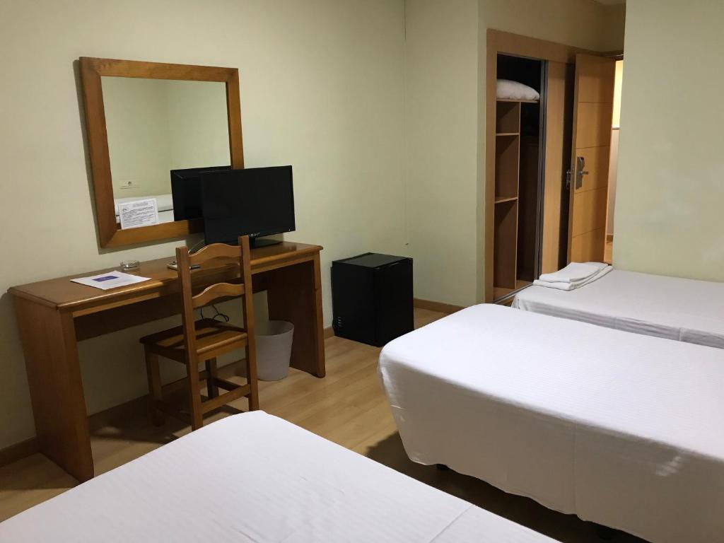 Postel nebo postele na pokoji v ubytování Hotel Anfora