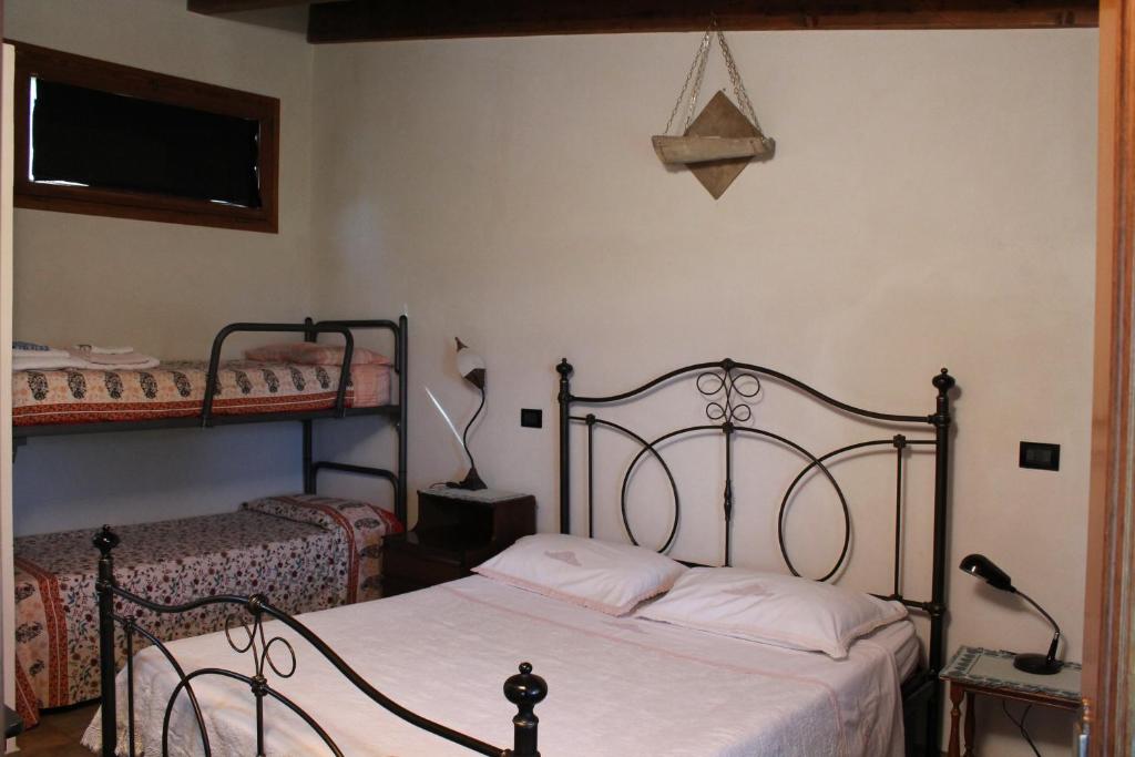 Postel nebo postele na pokoji v ubytování Agriturismo Montupoli