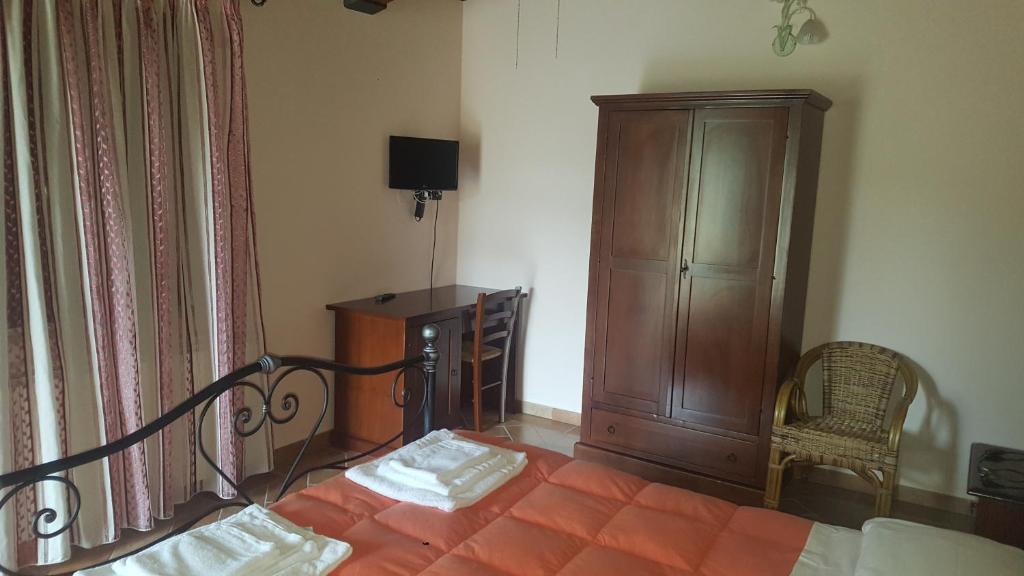 Łóżko lub łóżka w pokoju w obiekcie L'Antico Casale
