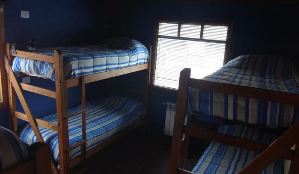 Postel nebo postele na pokoji v ubytování La Comarca Hostel