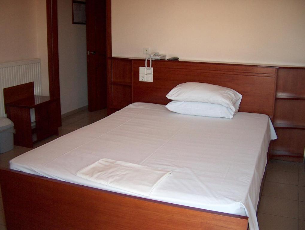 Postel nebo postele na pokoji v ubytování Hotel Olympion