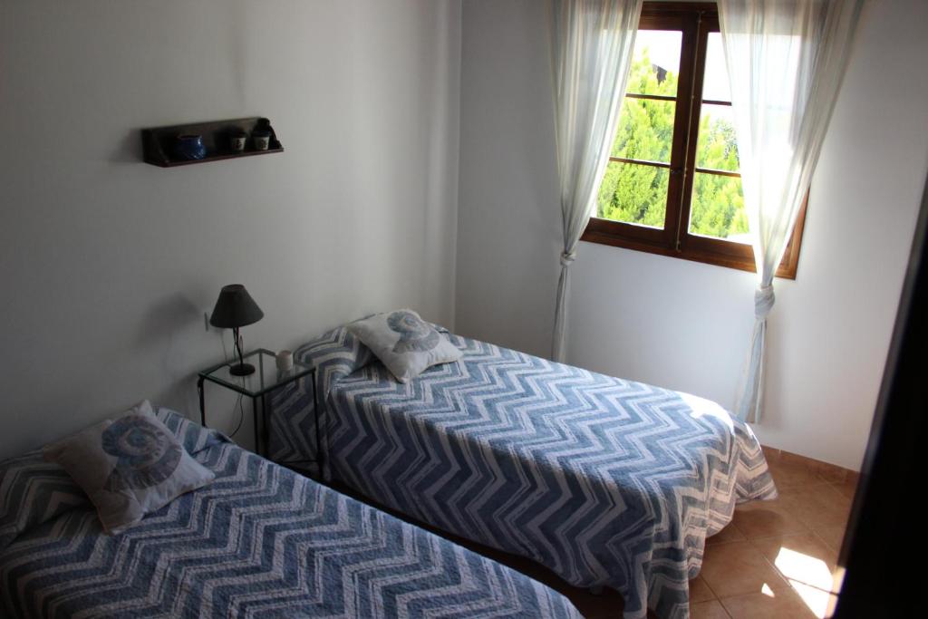 Posteľ alebo postele v izbe v ubytovaní Casa con jardín y piscina - MORELL ONZE