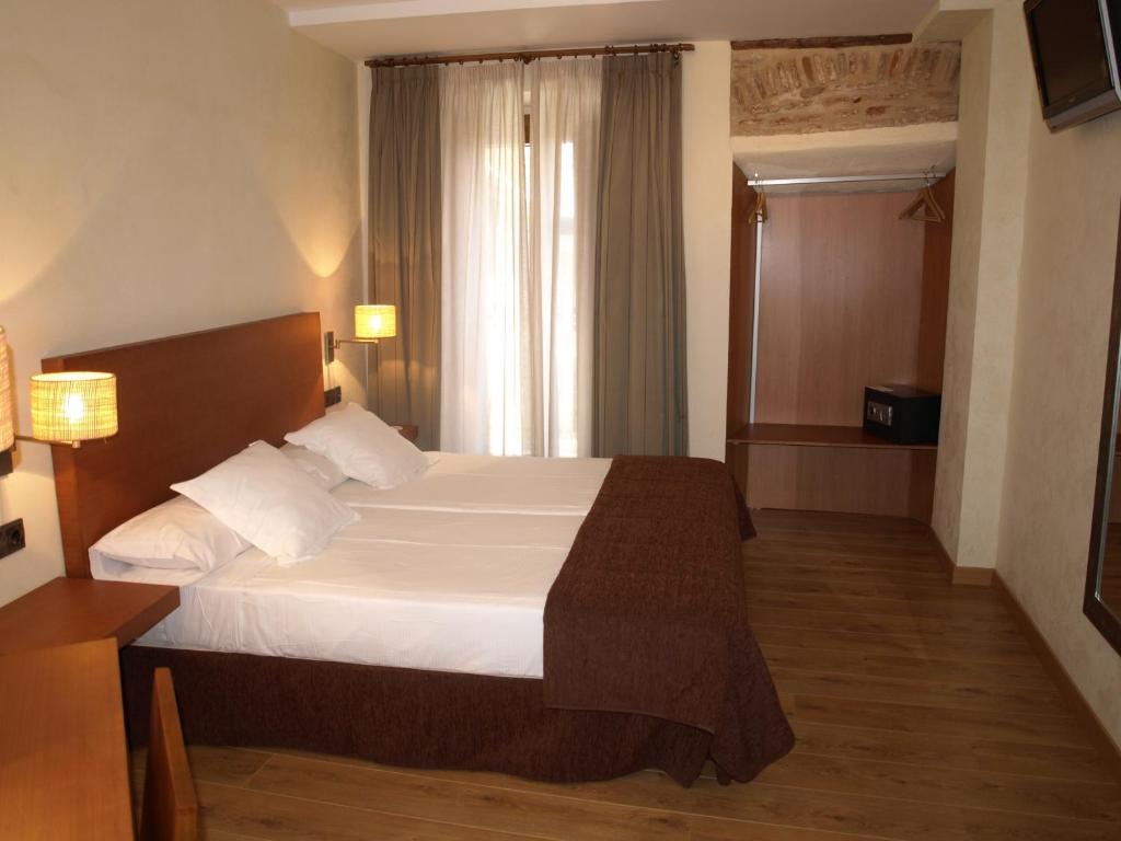 Postel nebo postele na pokoji v ubytování Hotel Las Leyendas