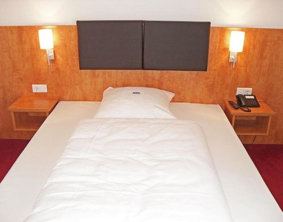 Postel nebo postele na pokoji v ubytování Hotel Neuwirtshaus