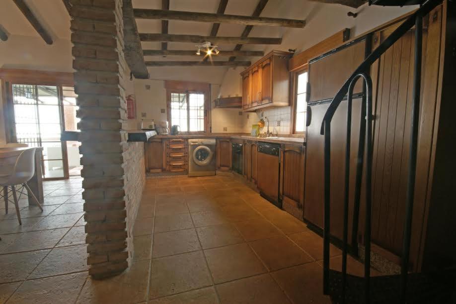 Kuchyňa alebo kuchynka v ubytovaní Villa Godoy