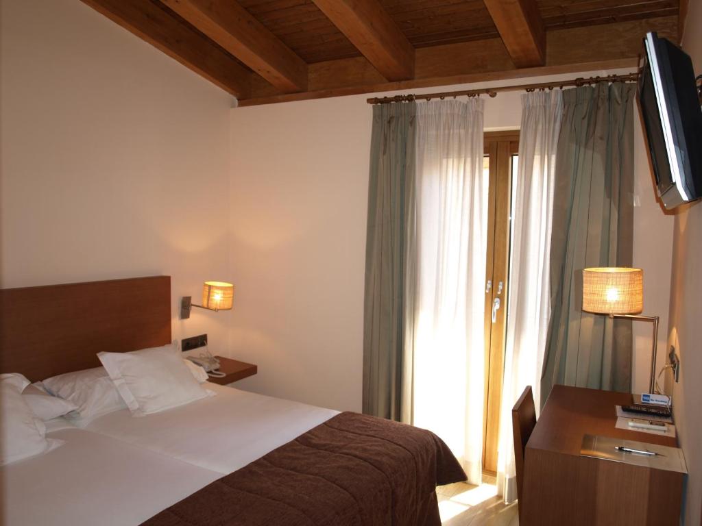 Postel nebo postele na pokoji v ubytování Hotel Las Leyendas