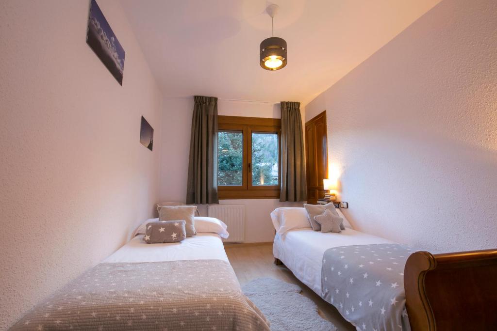 Postel nebo postele na pokoji v ubytování B&B La Lluna