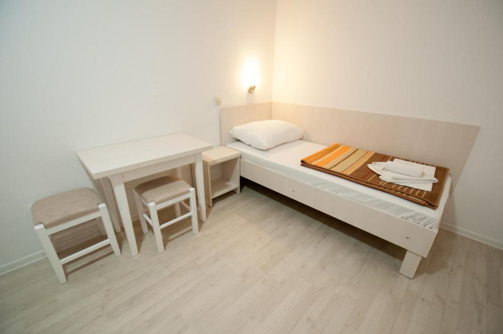 Postel nebo postele na pokoji v ubytování Pansion Obala