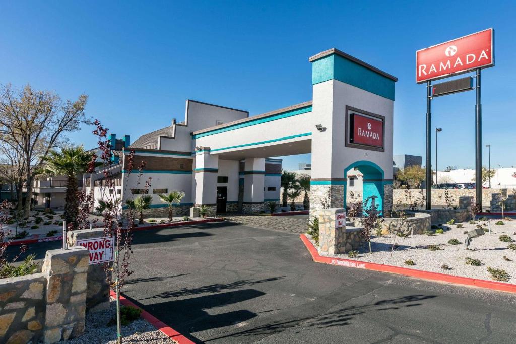 a gas station with a sign in front of it at Ramada by Wyndham El Paso in El Paso