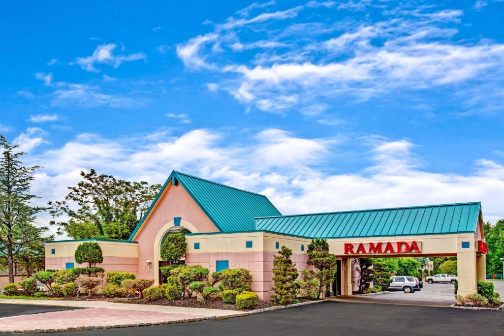 a building with a sign that reads ramaria at Ramada by Wyndham Parsippany in Parsippany