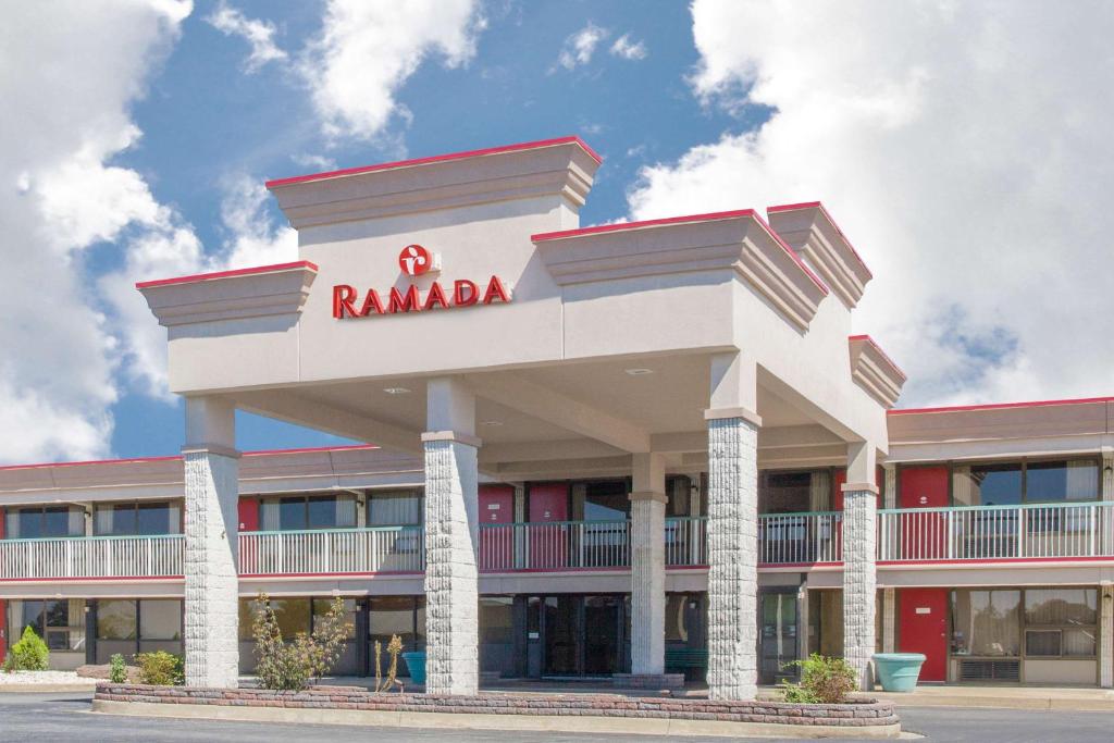 a building with a rambala sign on top of it at Ramada by Wyndham Edgewood Hotel & Conference Center in Edgewood