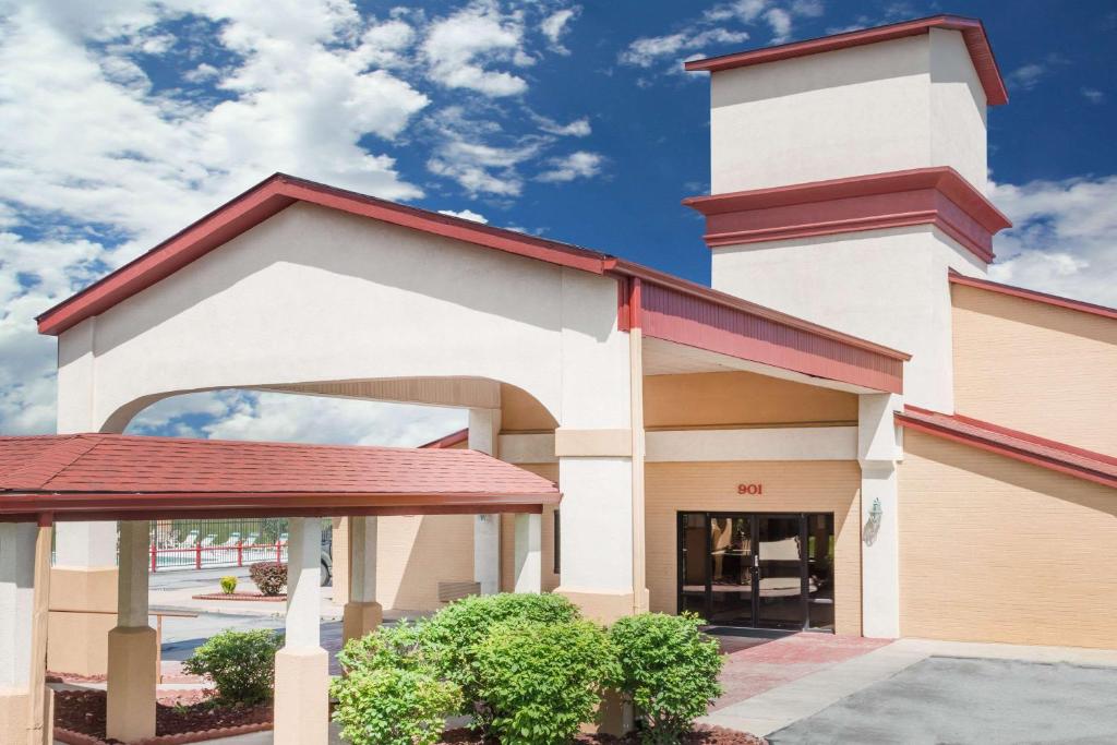 a building with a tower on top of it at Ramada by Wyndham Columbia in Columbia