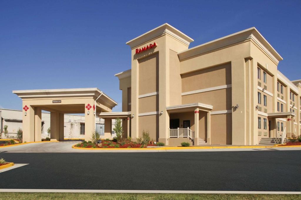a rendering of a building with a hotel at Ramada by Wyndham Tulsa in Tulsa