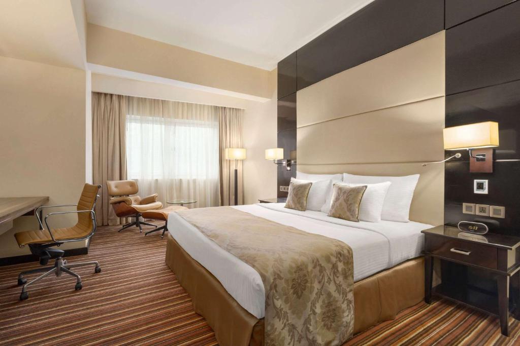 Postel nebo postele na pokoji v ubytování Ramada Colombo