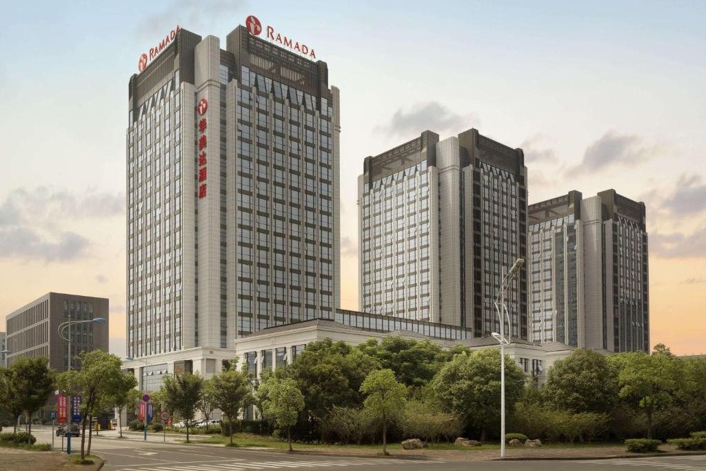 a group of tall buildings in a city at Ramada Jiaxing in Jiaxing
