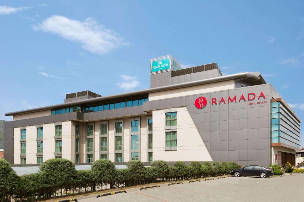 a building with a sign on top of it at Ramada by Wyndham Gemli̇k in Gemlik
