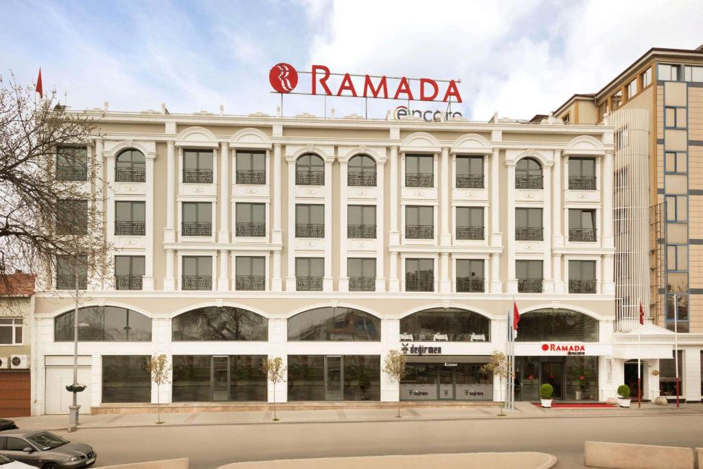 a white building with a sign on top of it at Ramada Encore Gebze in Gebze