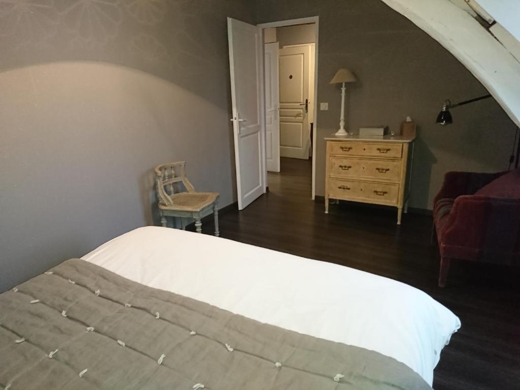 Postel nebo postele na pokoji v ubytování Côté Jardin - Chambres d'hôtes