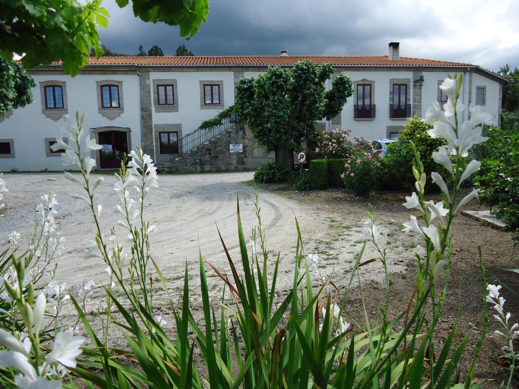 Um jardim no exterior de Quinta das Cegonhas