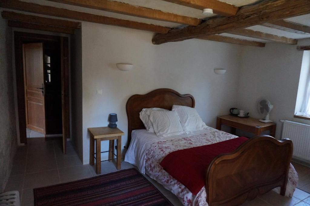 Postel nebo postele na pokoji v ubytování Au garcin