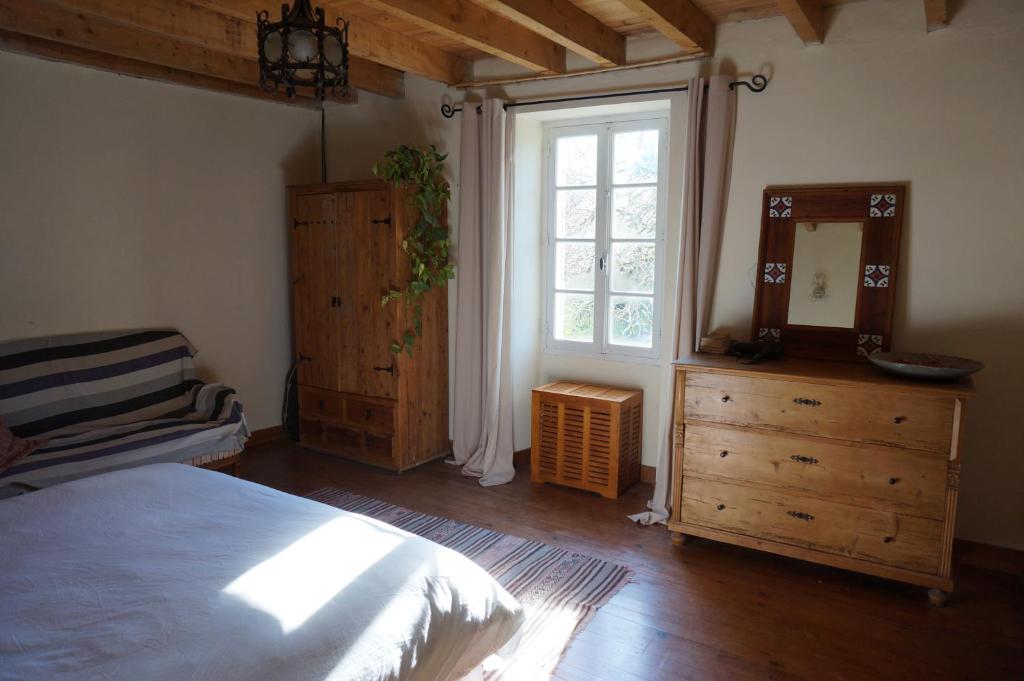 Postel nebo postele na pokoji v ubytování Au garcin