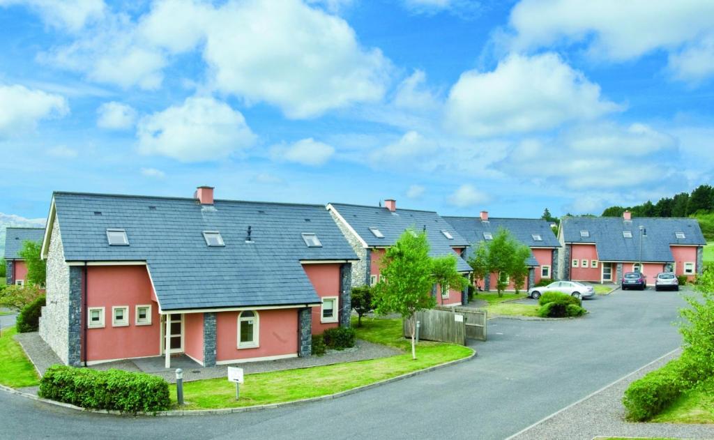 a row of houses in a residential neighbourhood at Ring of Kerry Holiday Cottages No 22 by Trident Holiday Homes in Kenmare