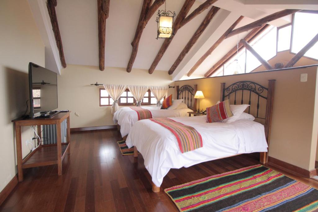 Postel nebo postele na pokoji v ubytování "LLipimpac Guesthouse"