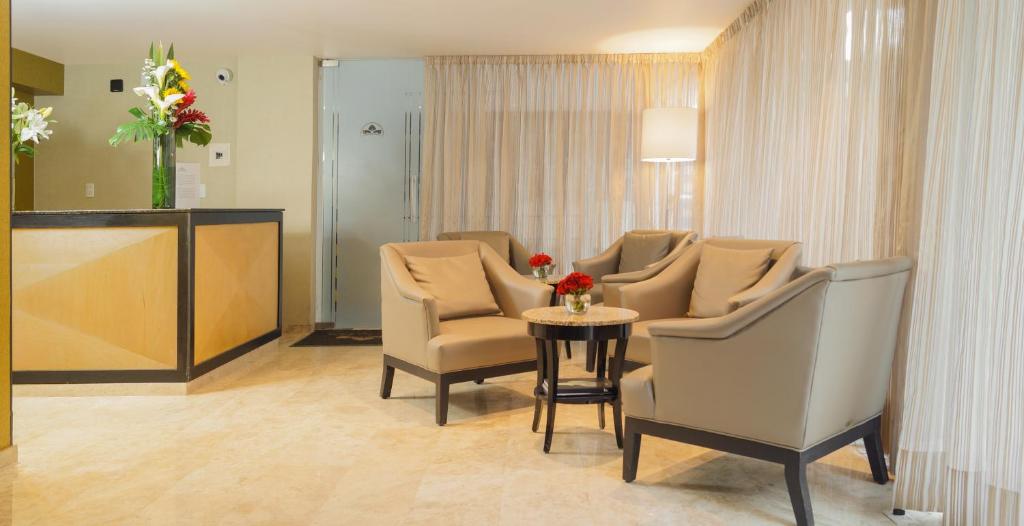 A softly lit seating area beside the reception desk.