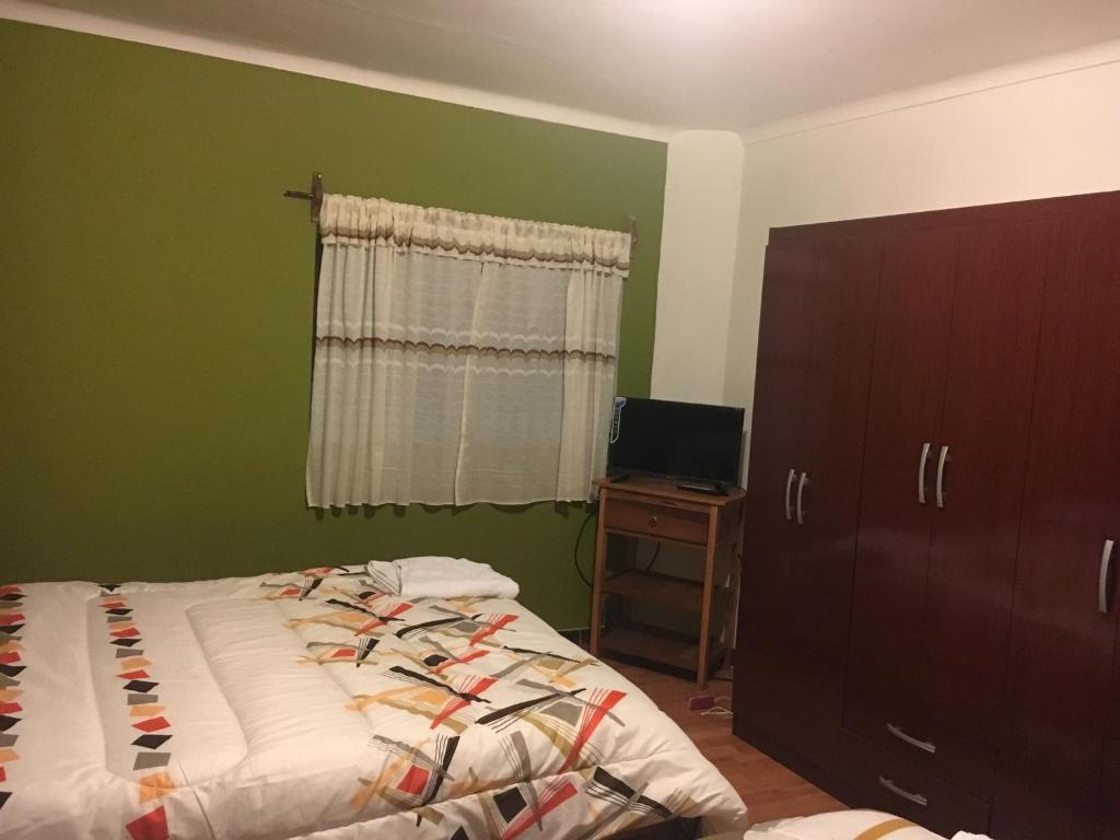 Postel nebo postele na pokoji v ubytování Casa Salkantay Cusco