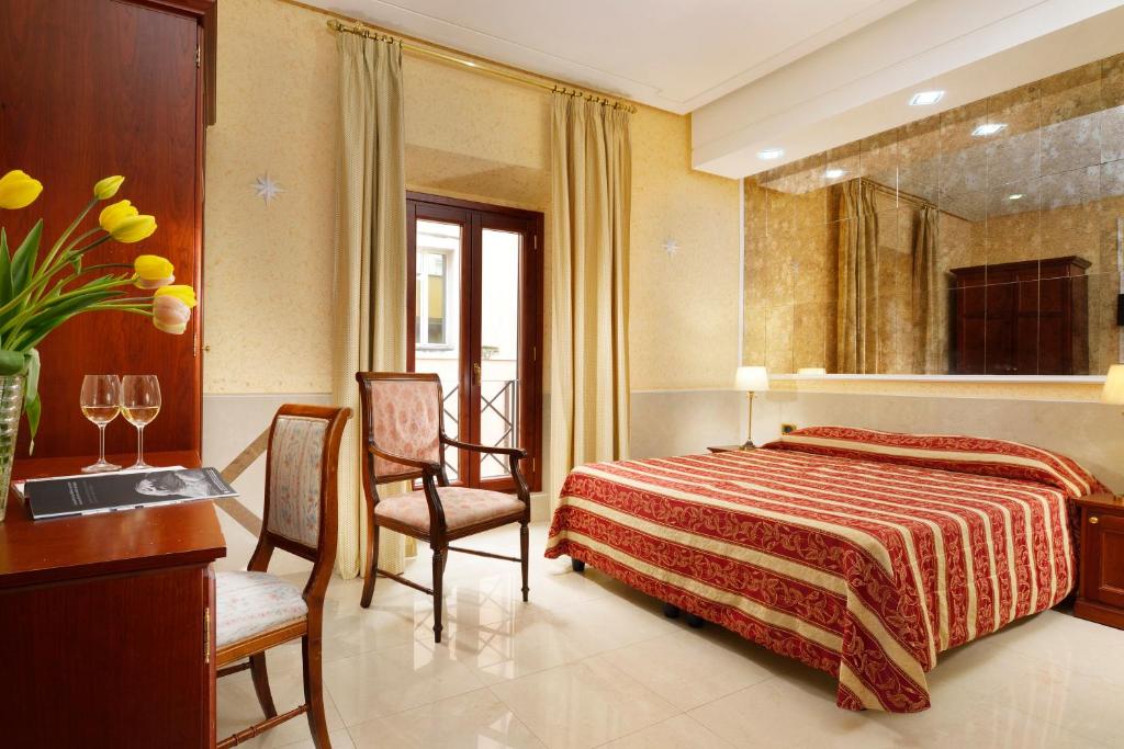 Postel nebo postele na pokoji v ubytování Hotel Bolivar