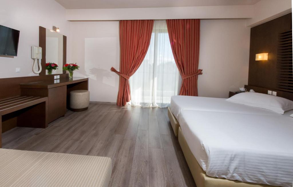 Postel nebo postele na pokoji v ubytování Agrinio Imperial Hotel