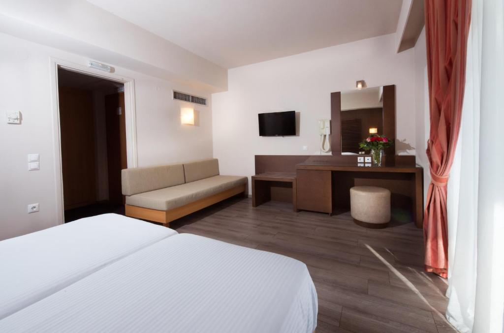 Postel nebo postele na pokoji v ubytování Agrinio Imperial Hotel